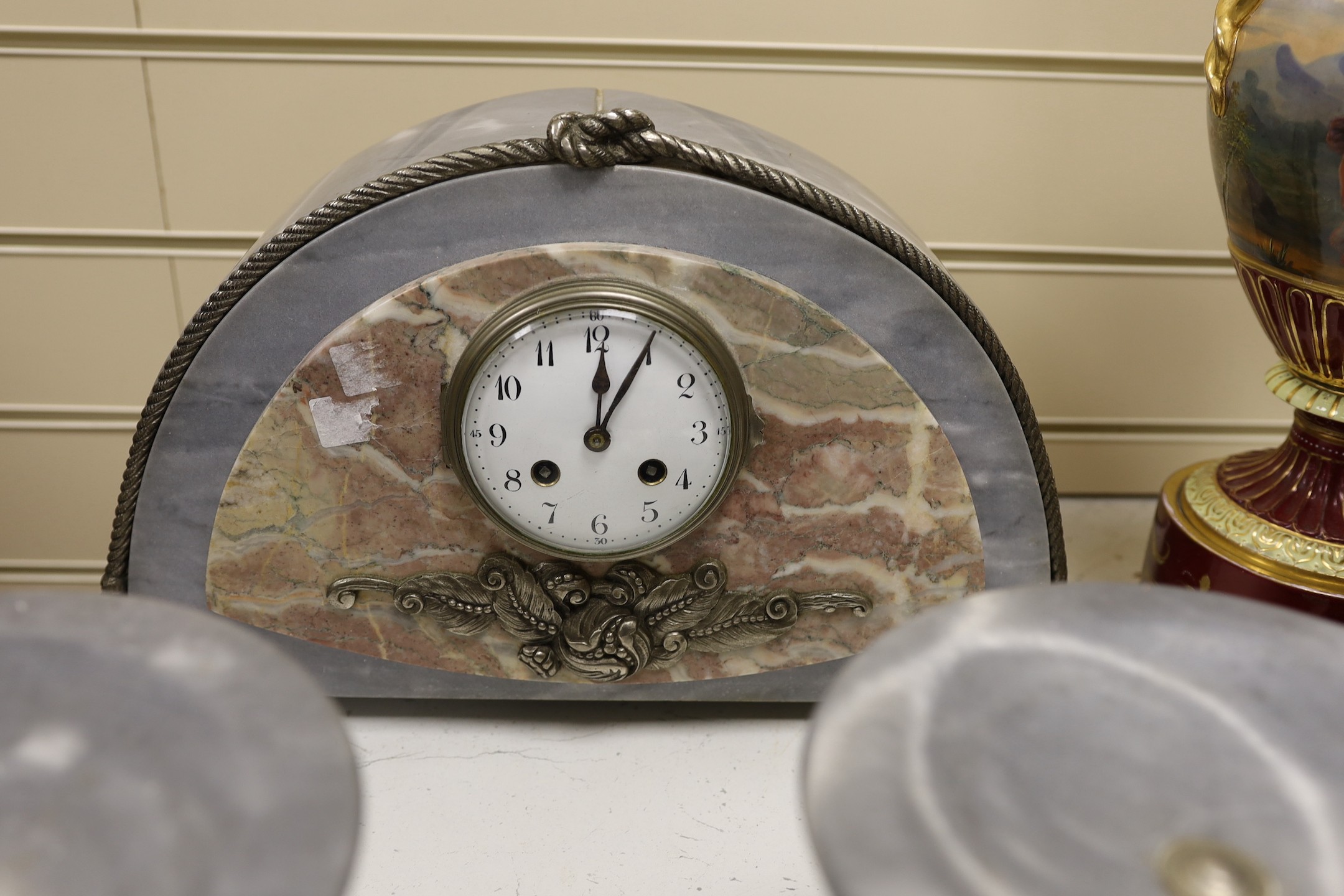 An Art Deco marble clock garniture with knotted ribbon decoration